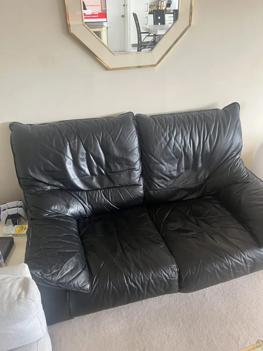 Black leather 2 seater sofa