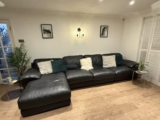 Barker and Stonehouse Natuzzi Modular Sofa with chaise. Black leather. 4 seater plus chaise