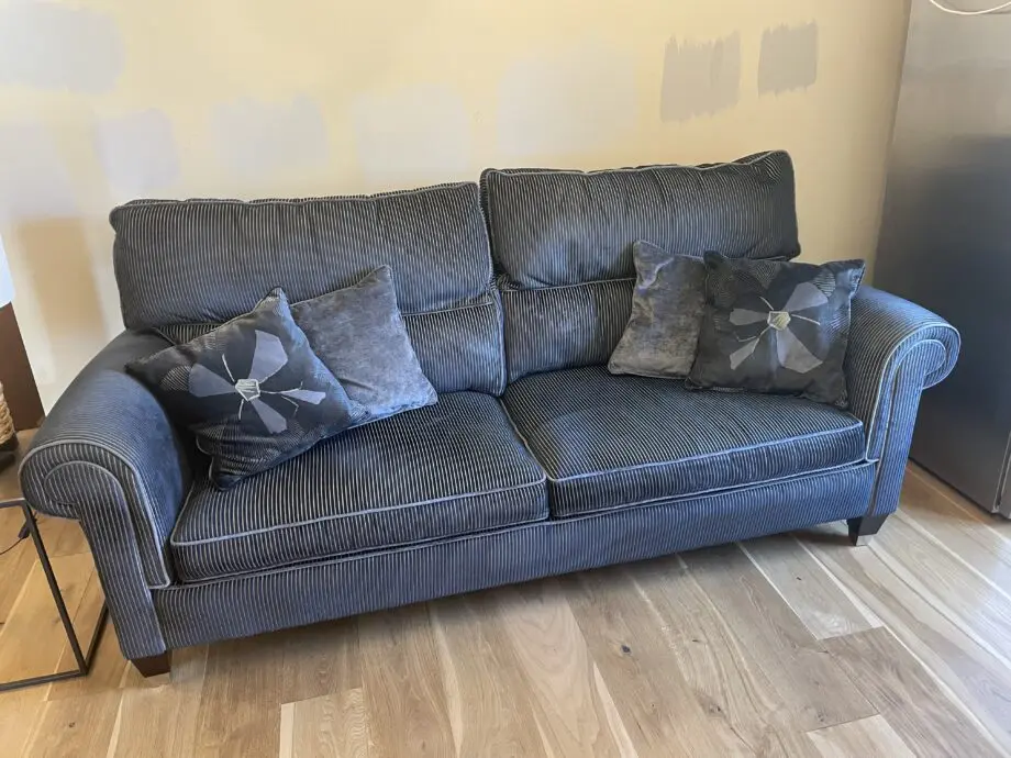 Duresta Kingston 3 piece suite. 2 x 4 seater high back settees (Colour Kensington Midnight with monarch anthracite piping) and 1 Kingston high back armchair in monarch anthracite with matching piping.