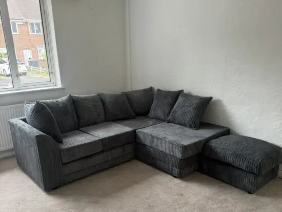 Charcoal jumbo 4 seater sofa with footstool
