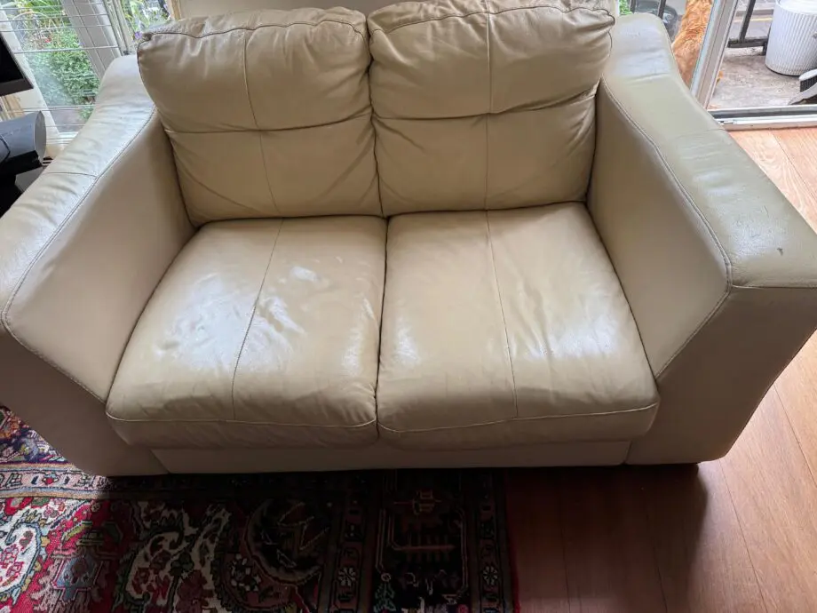Cream real leather Otium Italian manufactured two seat sofa