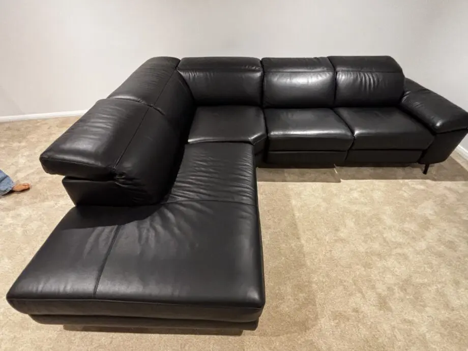 Nattuzzi black 2 electric recliners 1 month old corner sofa