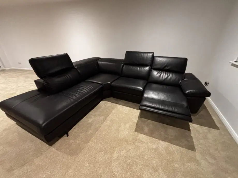 Nattuzzi black 2 electric recliners 1 month old corner sofa