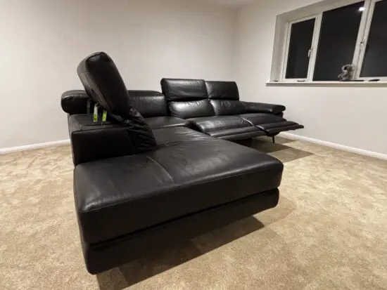 Nattuzzi black 2 electric recliners 1 month old corner sofa
