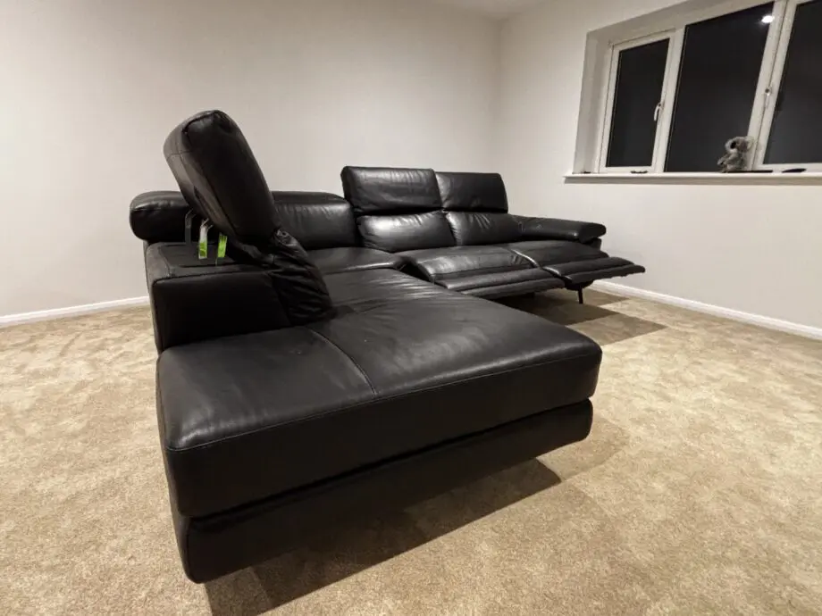 Nattuzzi black 2 electric recliners 1 month old corner sofa