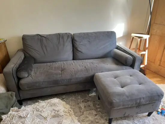 Grey sofa with foot stall