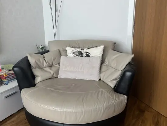 DFS beige swivel chair sofa