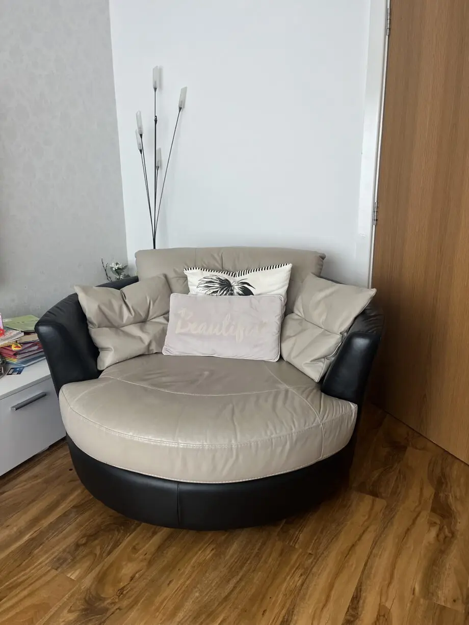 DFS beige swivel chair sofa