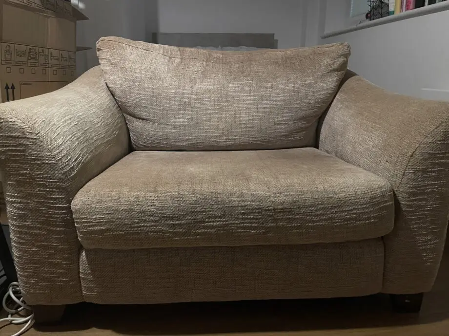 Tan two-seater sofa in good condition