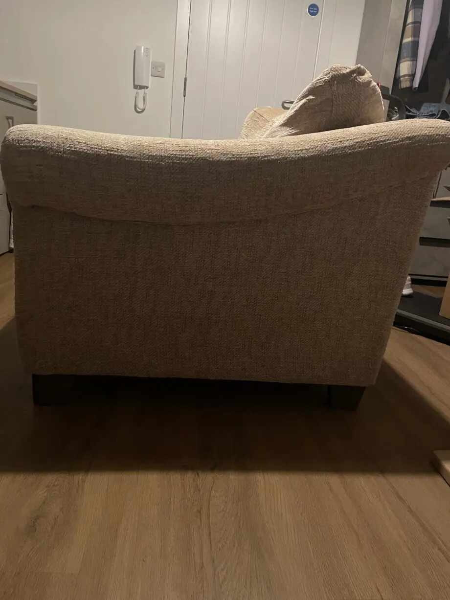 Tan two-seater sofa in good condition