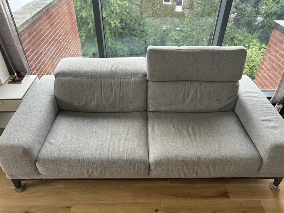 Natuzzi 2 Seater fabric grey sofa