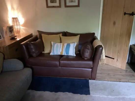 Fabulous small 2-seater MultiYork leather sofa with side booster cushions.
