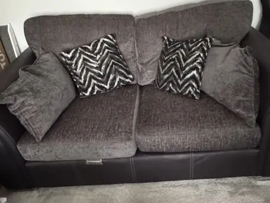 DFS 2-Seater Grey Fabric & Black Leather Sofa