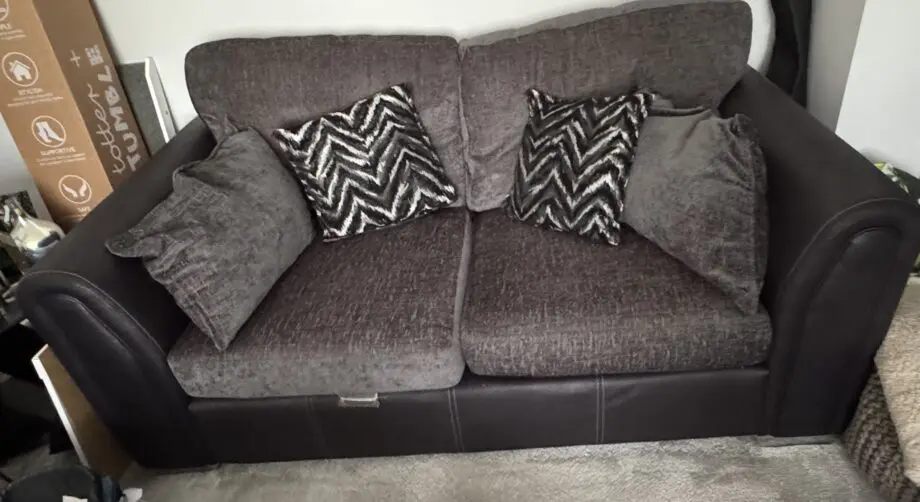 DFS 2-Seater Grey Fabric & Black Leather Sofa
