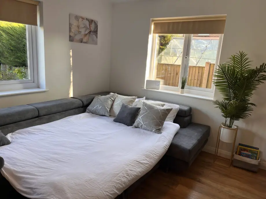 Grey corner with storage and double sofa bed