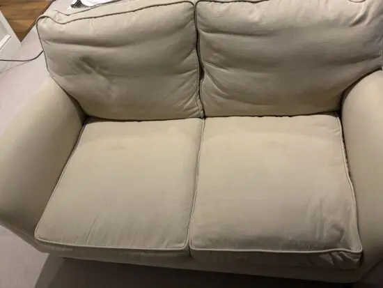 Highly Sprung cream/light beige 2 seater sofa