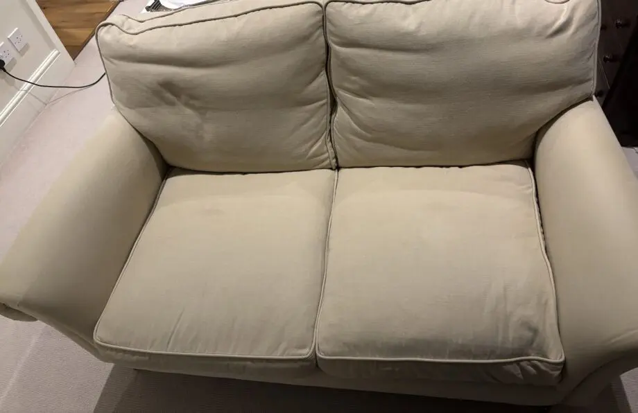 Highly Sprung cream/light beige 2 seater sofa