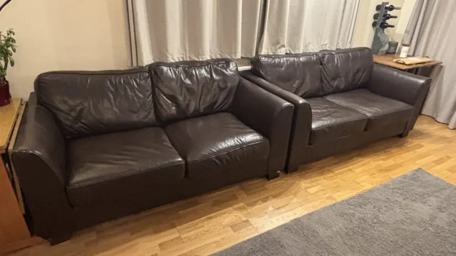 Twin brown real leather sofas