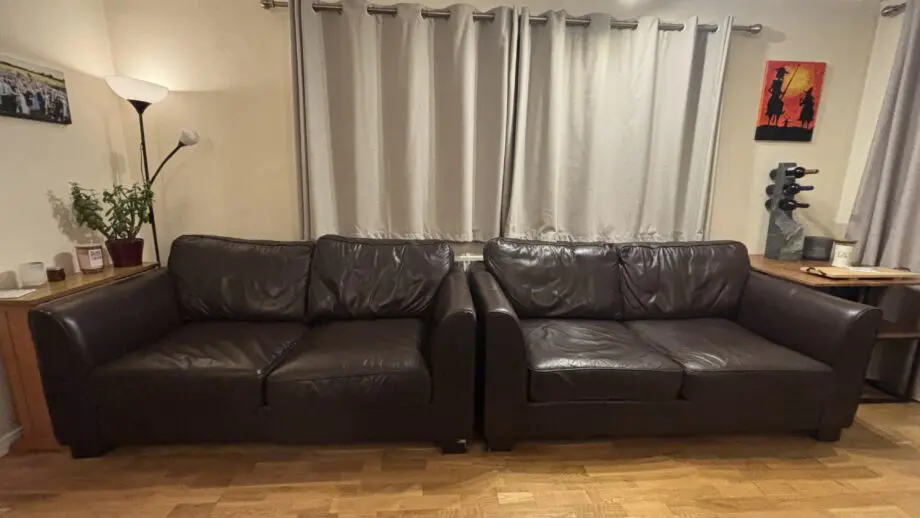Twin brown real leather sofas