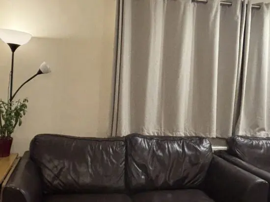 Brown two seater real leather sofa