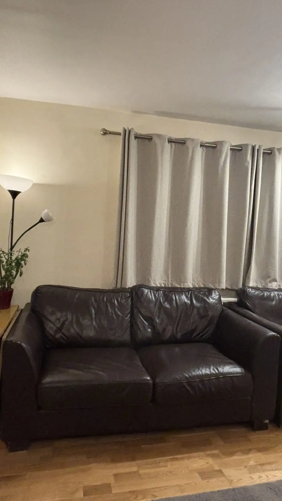 Twin brown real leather sofas