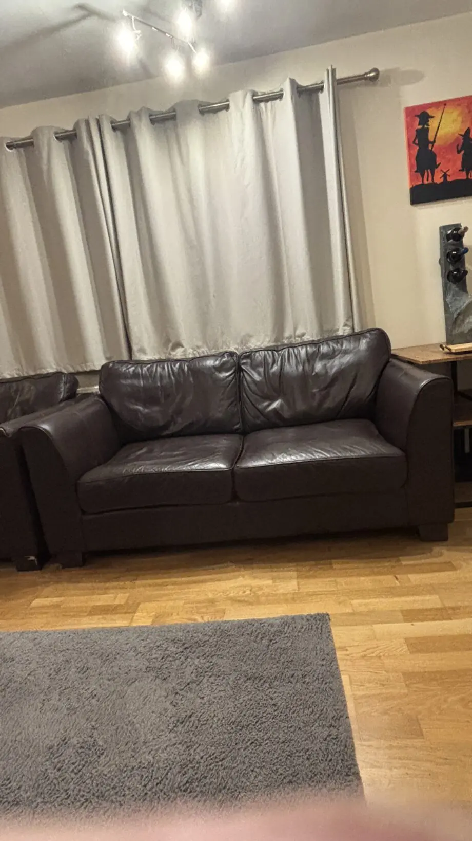 Twin brown real leather sofas