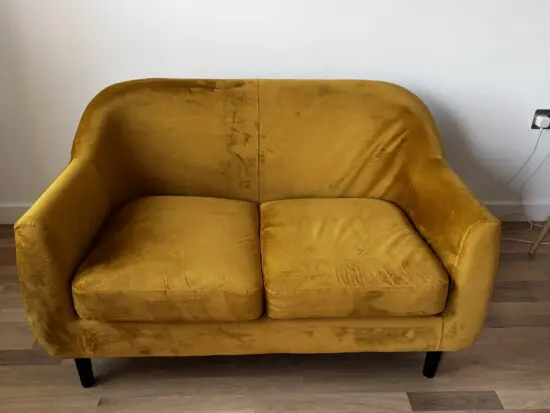 Mustard/yellow velvet 2seater sofa from Made