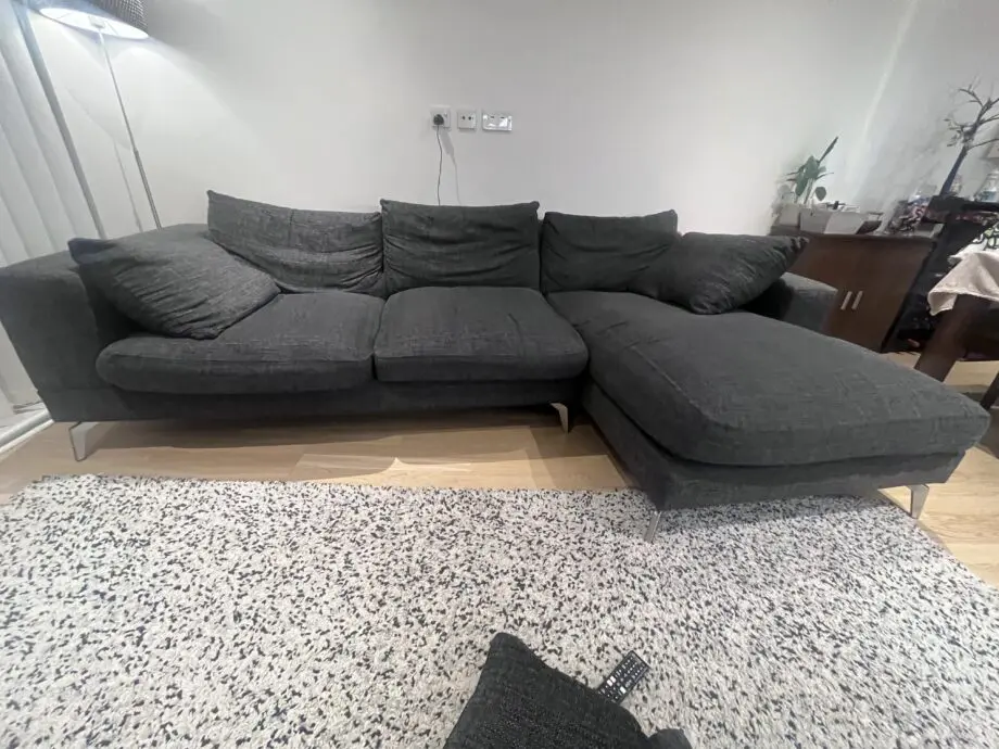 Stylish and comfortable corner sofa upholstered in a durable dark grey fabric