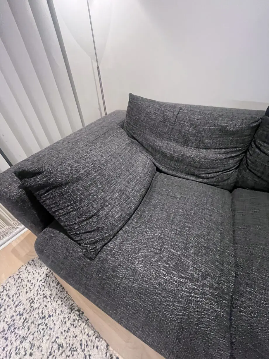 Stylish and comfortable corner sofa upholstered in a durable dark grey fabric