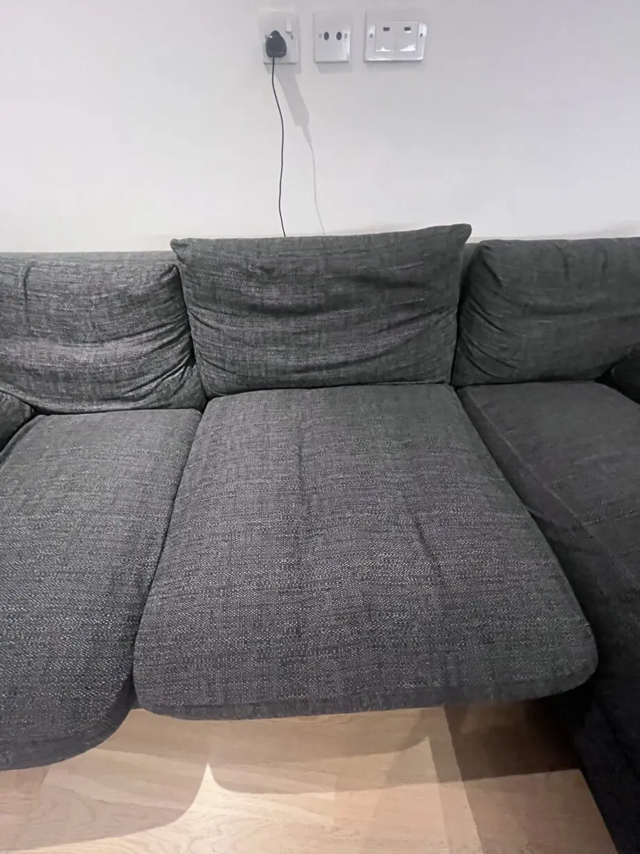 Stylish and comfortable corner sofa upholstered in a durable dark grey fabric