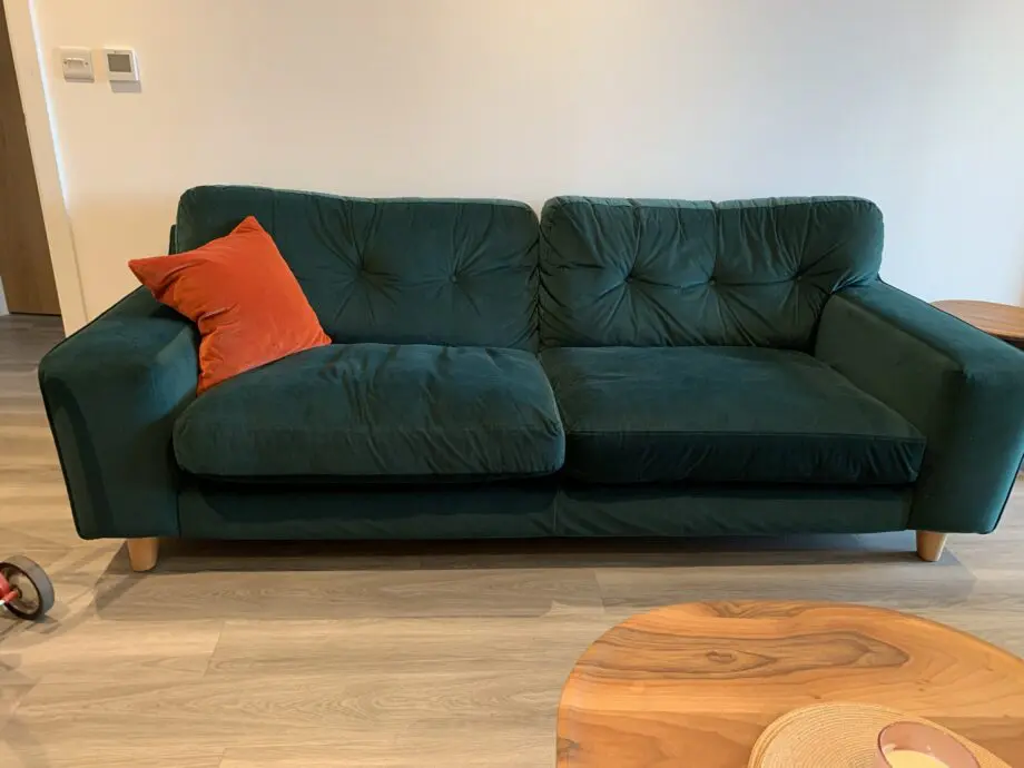 Green three seater and two seater almost new sofas