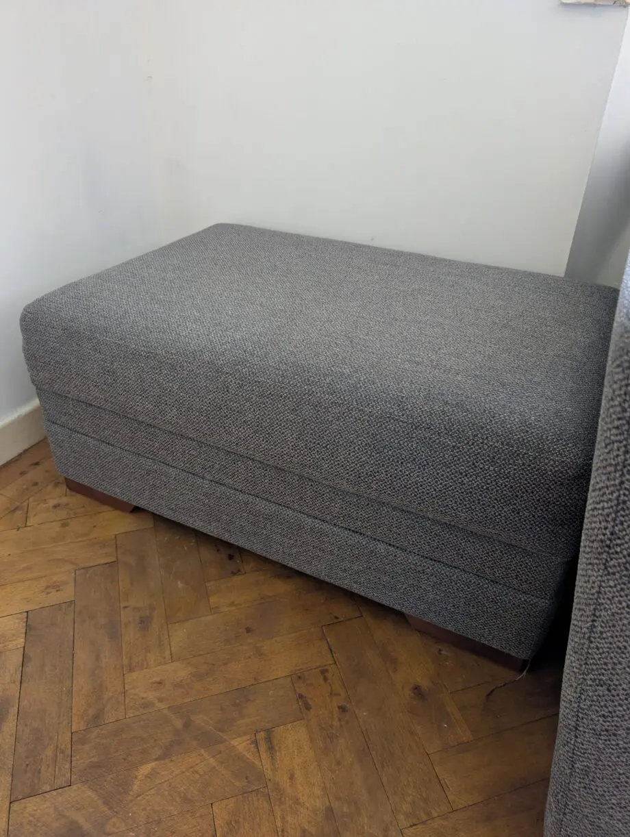 Grey corner sofa with storage footstool