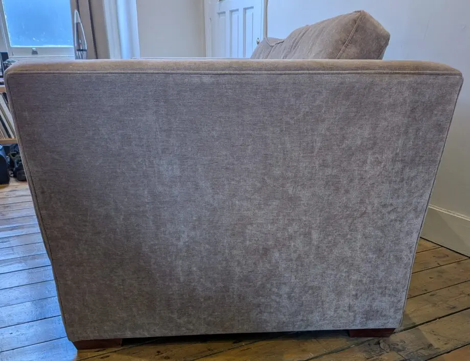 Light taupe three seat sofa bed in excellent condition