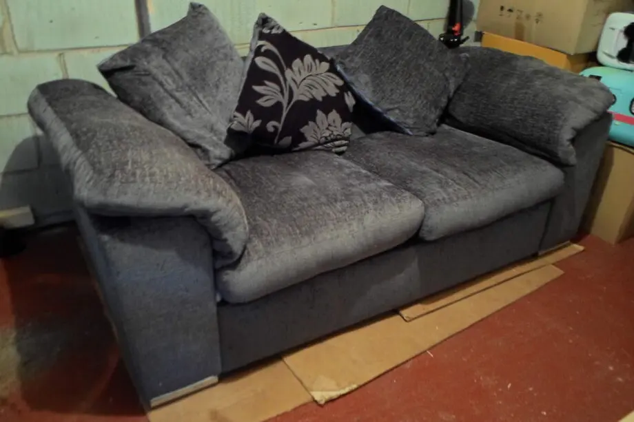Charcoal 2 seater sofa bed with chrome front feet