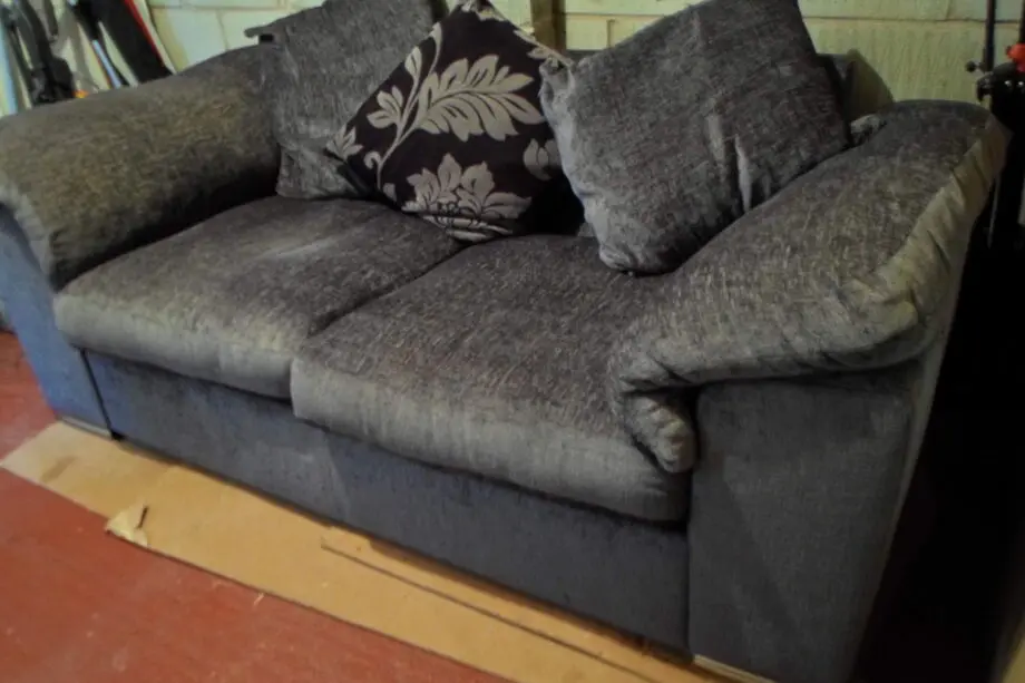 Charcoal 2 seater sofa bed with chrome front feet