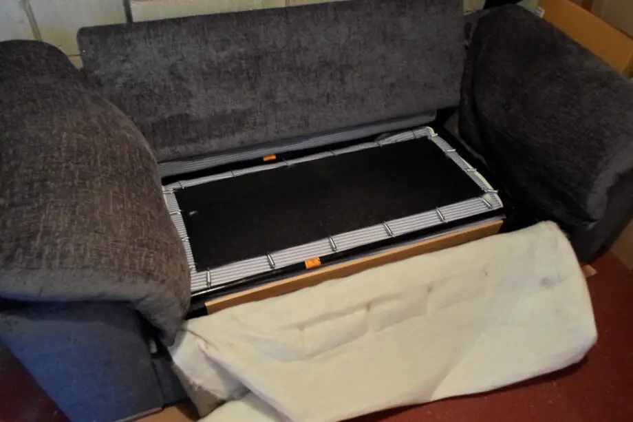 Charcoal 2 seater sofa bed with chrome front feet