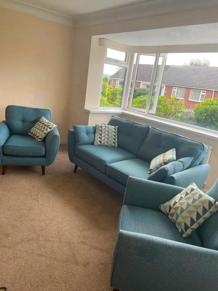 DFS French Connection Zinc three-seat sofa and two chairs in teal, and scatter cushions