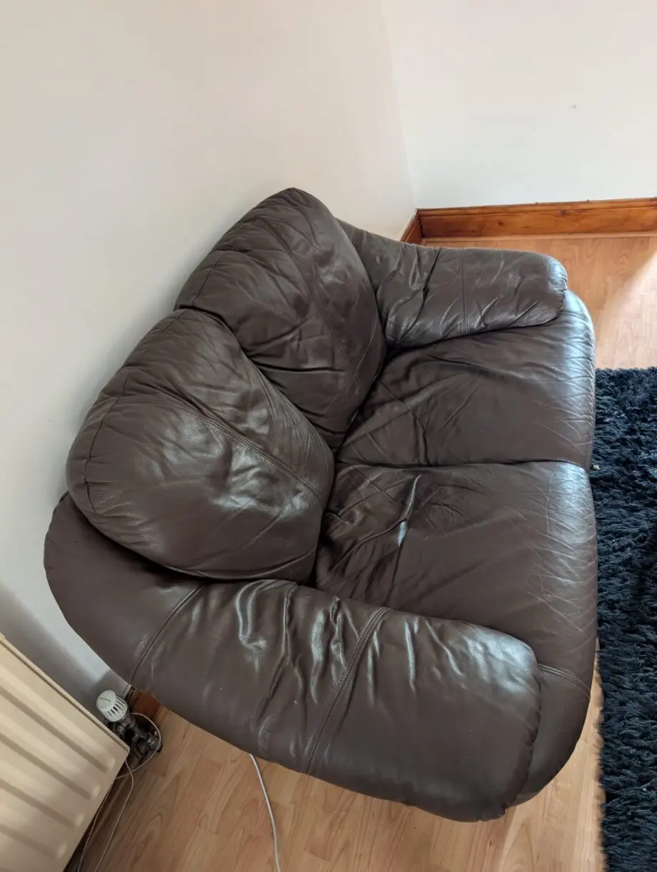 2 seater brown coloured sofa
