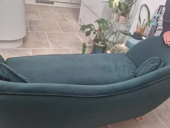 Deep green velvet sofa
