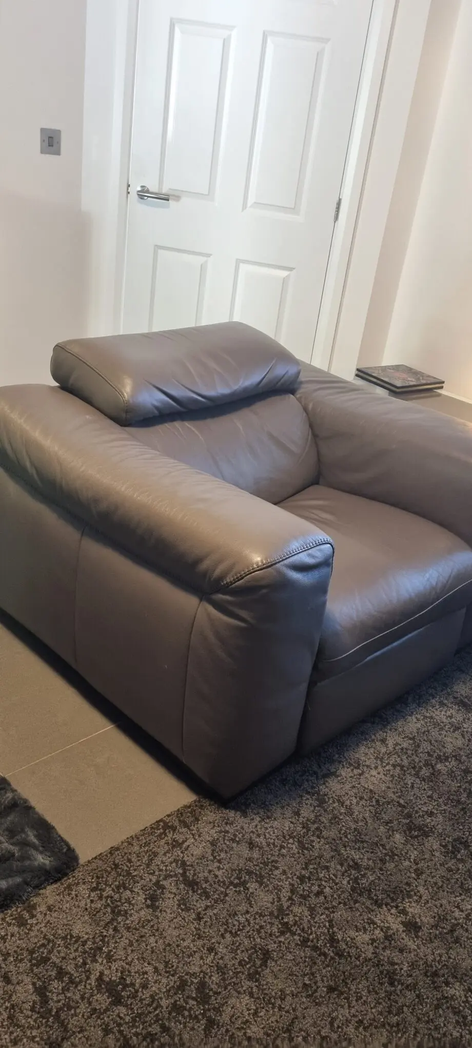 Natzzui power recliner chair. In stone leather
