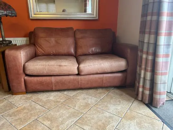 Brown leather double sofa bad
