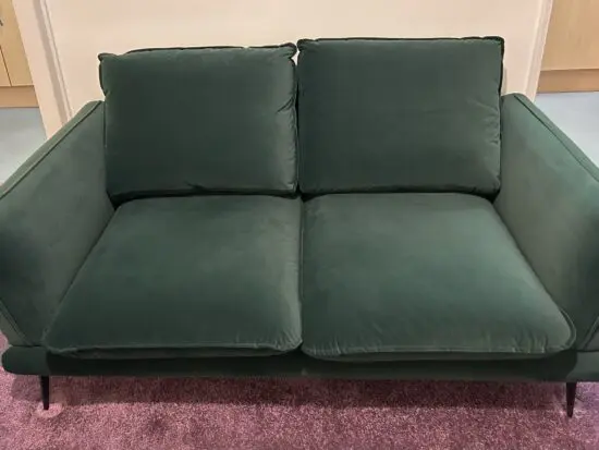 Compact 2 seater, forest green, poly velvet sofa by Daals. Nearly New