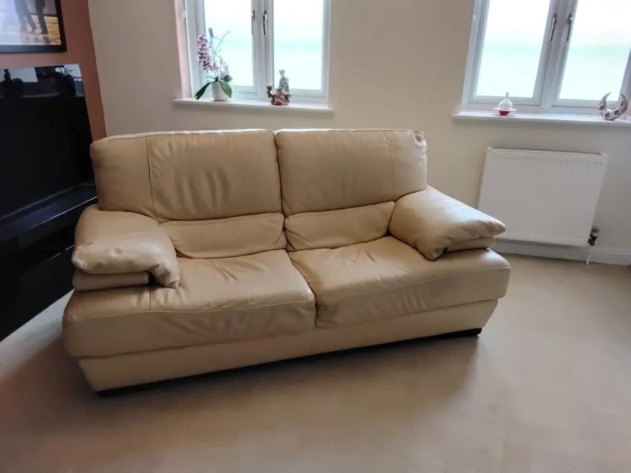 Two seater cream Italian leather sofa