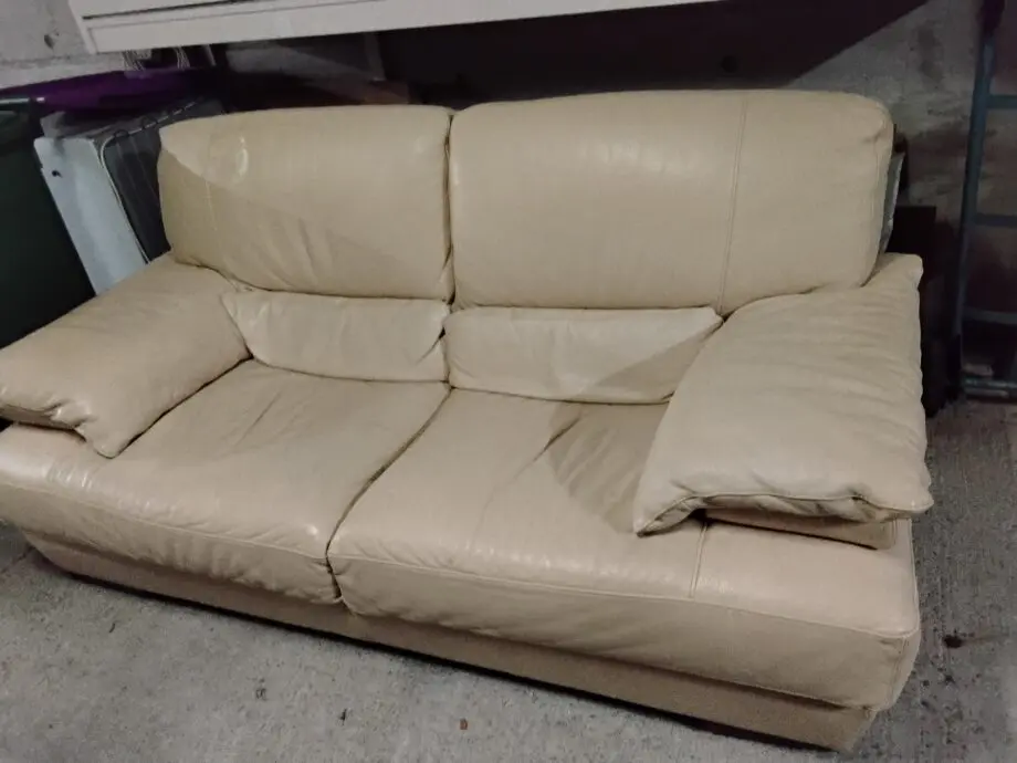 Two seater cream Italian leather sofa