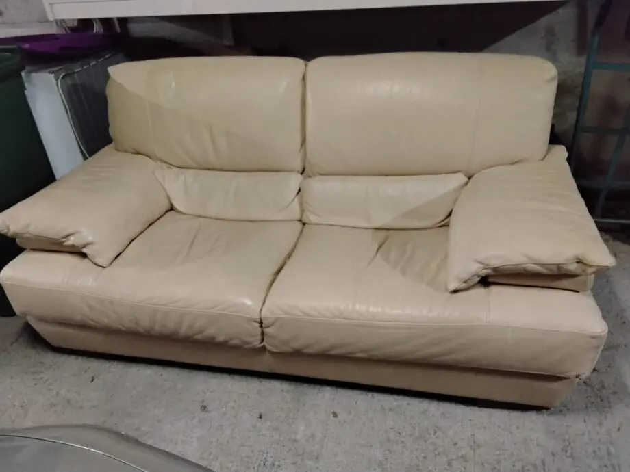 Two seater cream Italian leather sofa