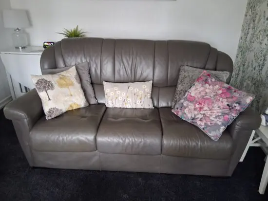 Italian leather three piece suite with storage footstool