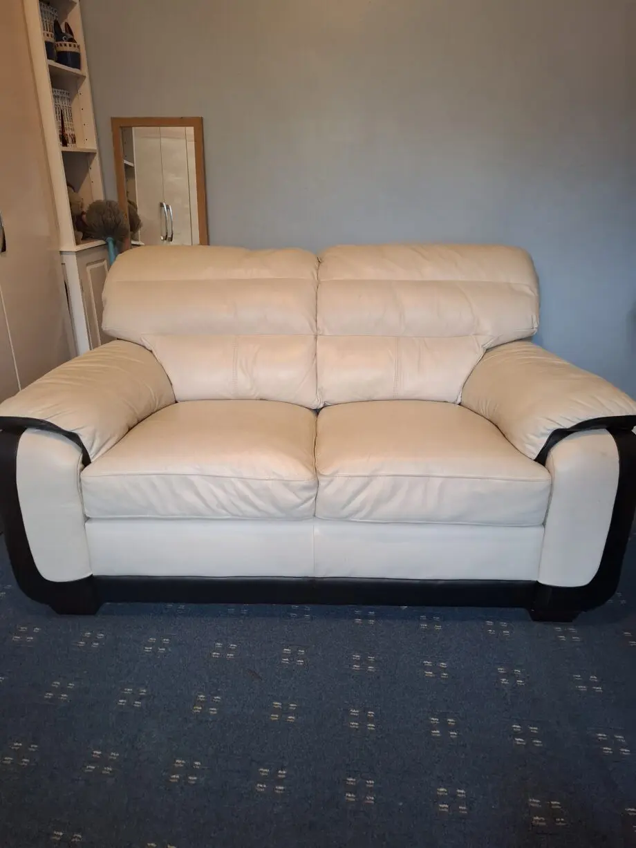 Cream and black leather 2 seater sofa