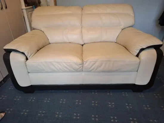 Cream and black leather 2 seater sofa