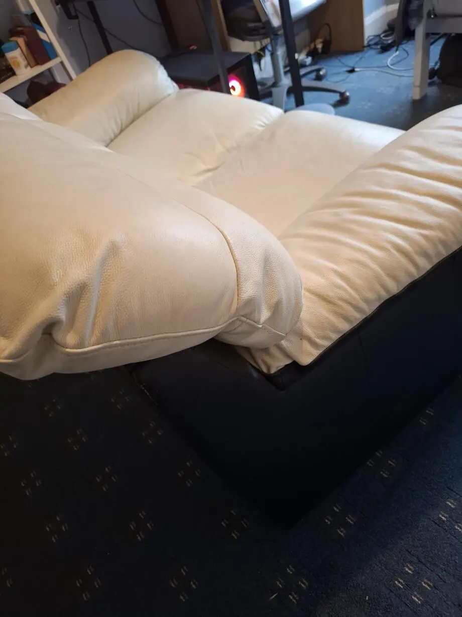Cream and black leather 2 seater sofa