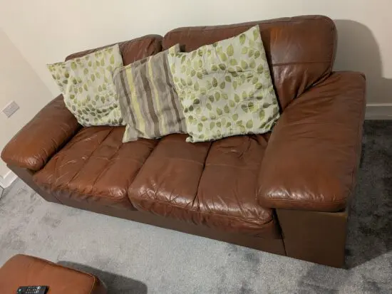 Two times two seaters with a chair and a foot storage stool.